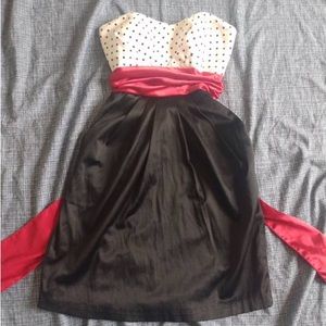 S pattern then black dress with red belt attached